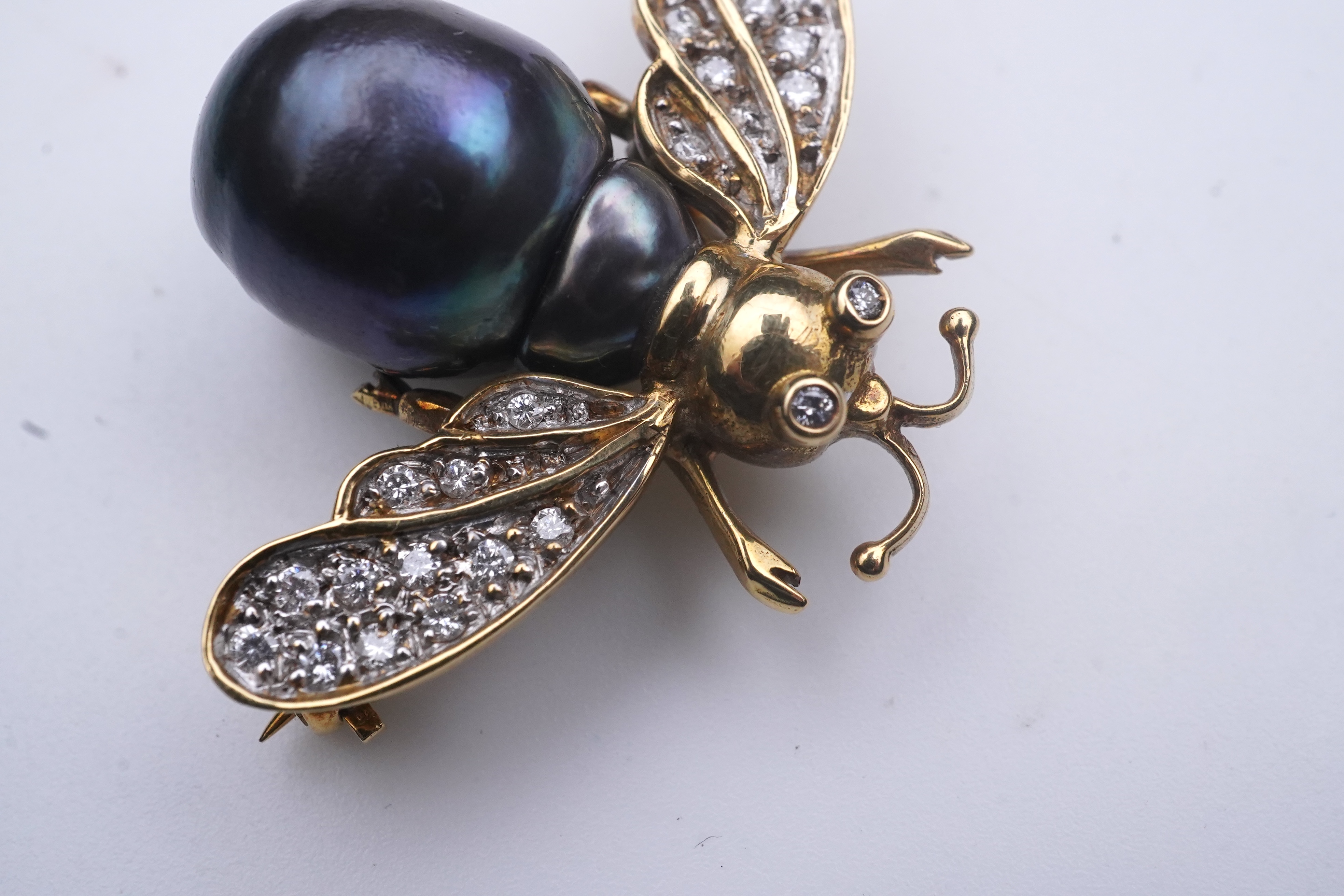 Deakin & Francis, a pair of 18ct gold, cultured pearl and diamond brooches